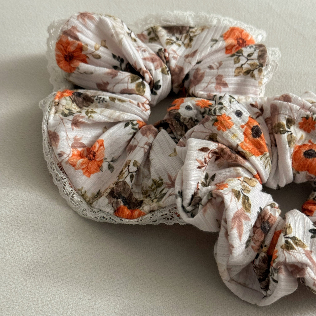 Floral patterned scrunchie on a light background