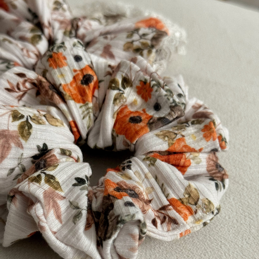 Floral patterned scrunchie on a light background