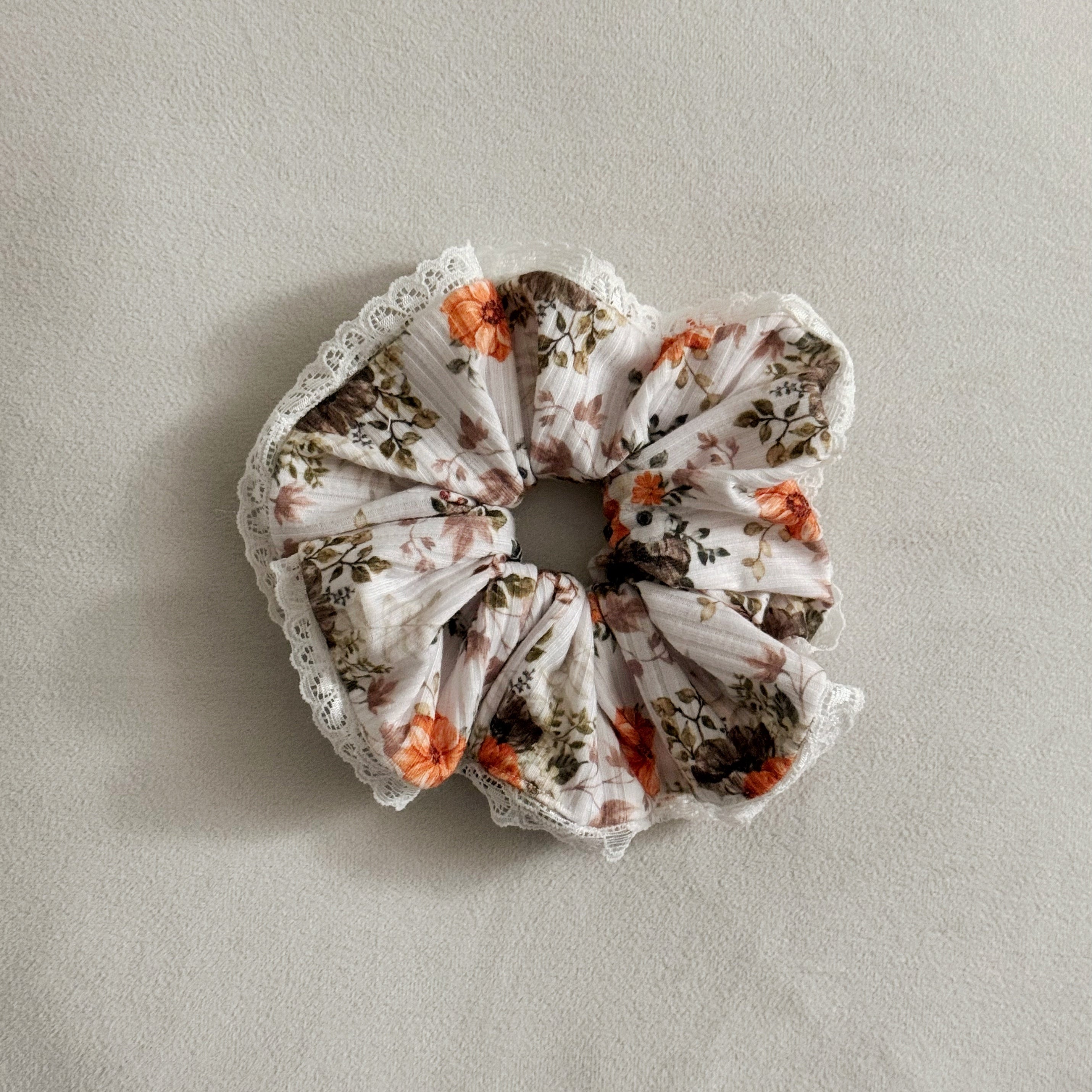Floral scrunchie on a light gray background